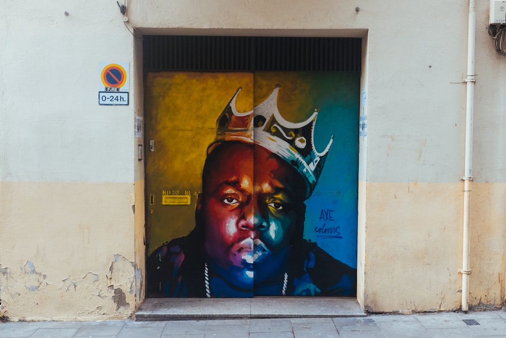 man wearing crown graphic wall