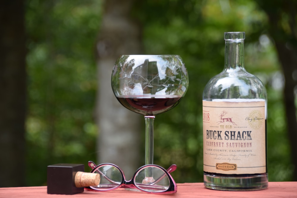 wine glass near Buck Shack bottle