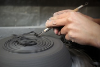 A compact mini pottery wheel in a creative workspace.
