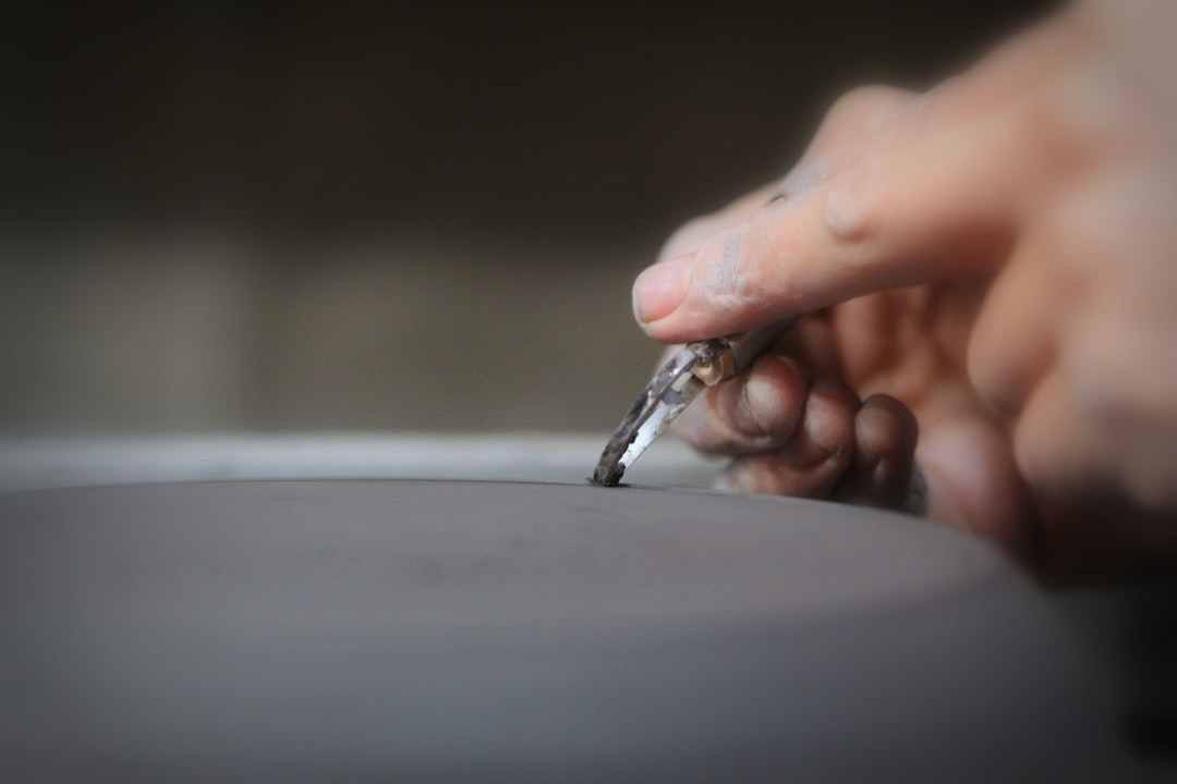 shallow focus photo of person's hands