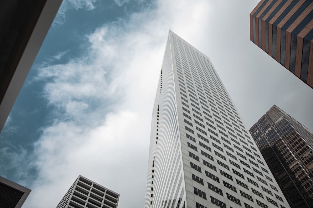 looking up at tall buildings in a city