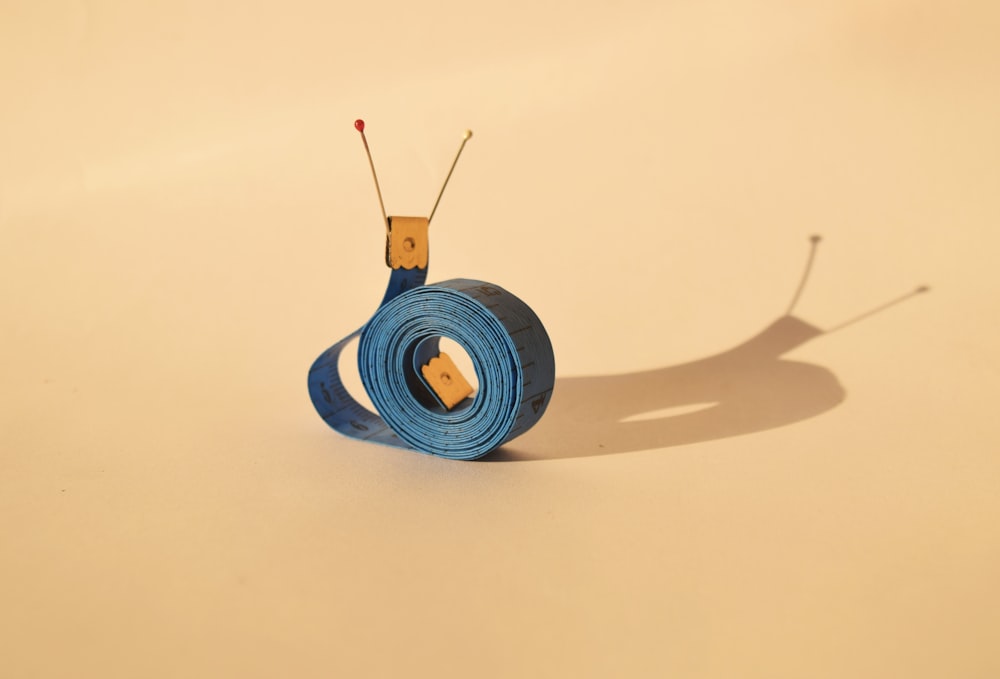 snail-shaped blue and yellow strap