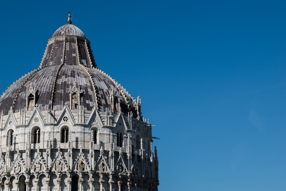 grey concrete dome under blue calm sky