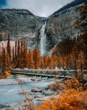 metal bridge near waterfall