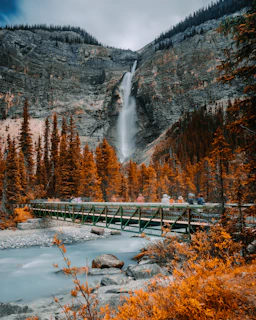 metal bridge near waterfall
