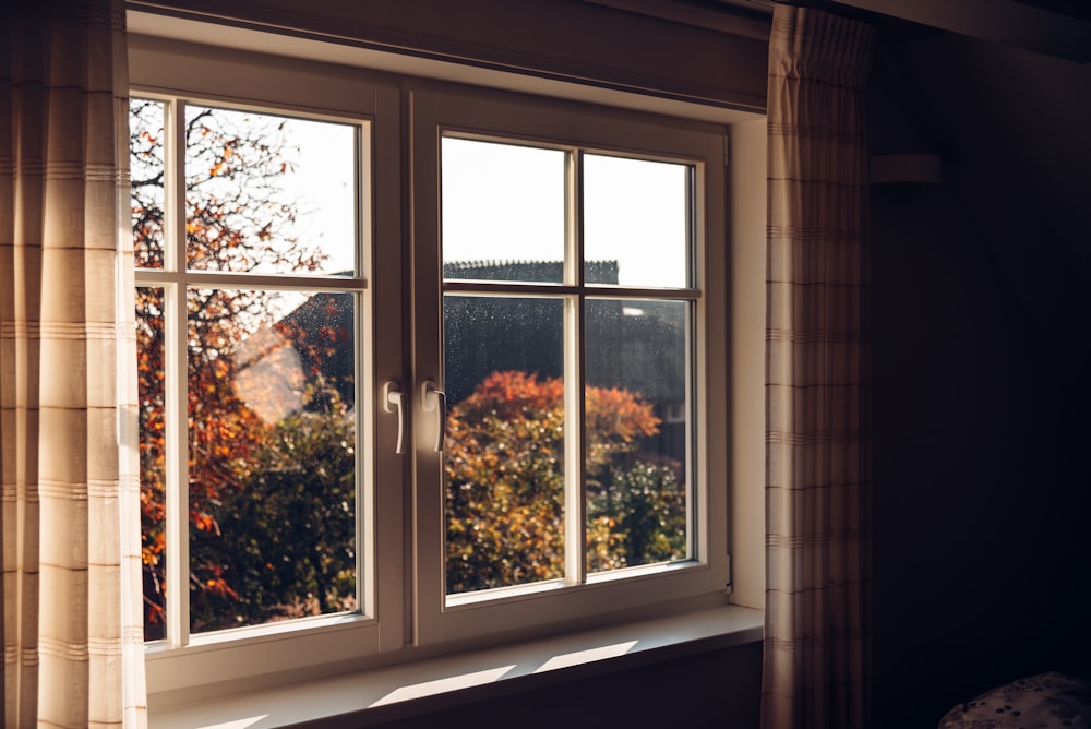 white wooden framed glass window