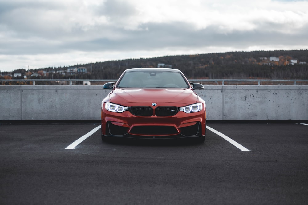 red BMW car park at the parking lot