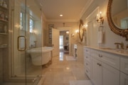 dresser near glass shower stall