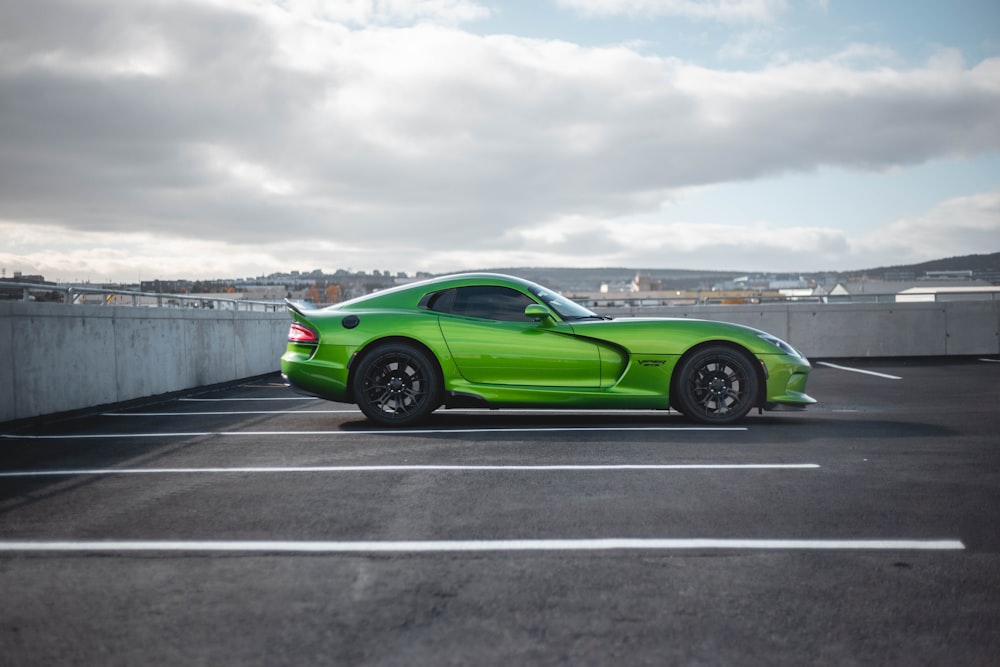 parked green coupe on parking lot