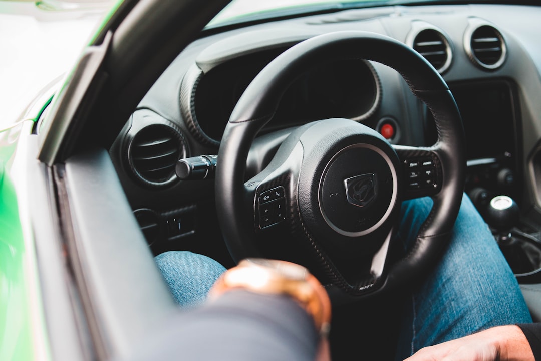 selective-focus of black car steering wheel