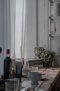 A cozy kitchen scene featuring premium linen tablecloth and leather accessories from Izham.