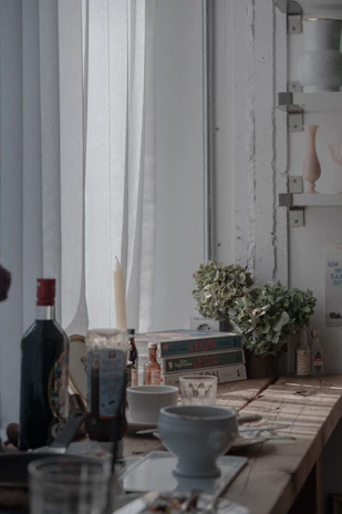 A cozy kitchen scene featuring premium linen tablecloth and leather accessories from Izham.