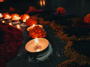 An inviting space with candles and flowers, symbolizing peace and spirituality.