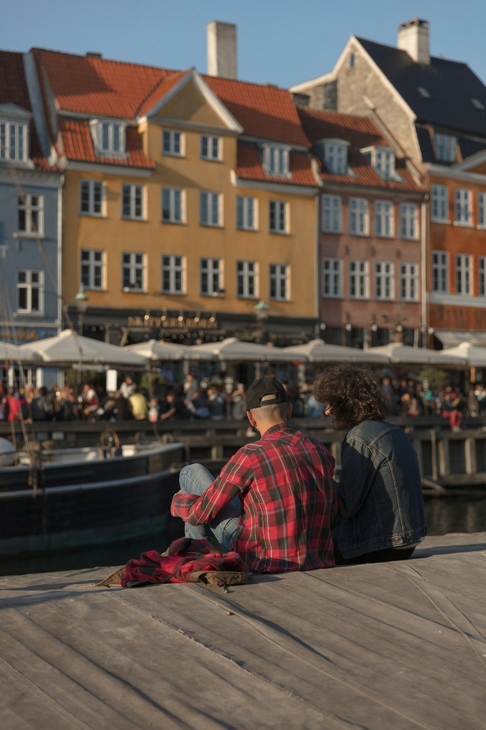 person wearing red and black flannel shirt