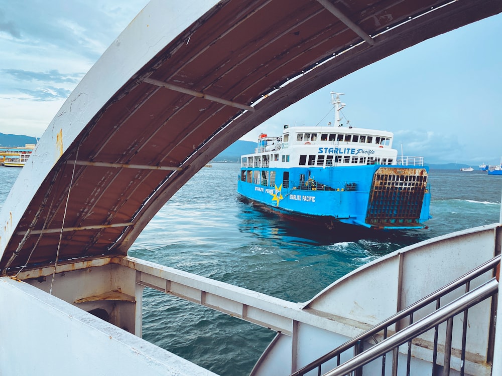 white and blue boat