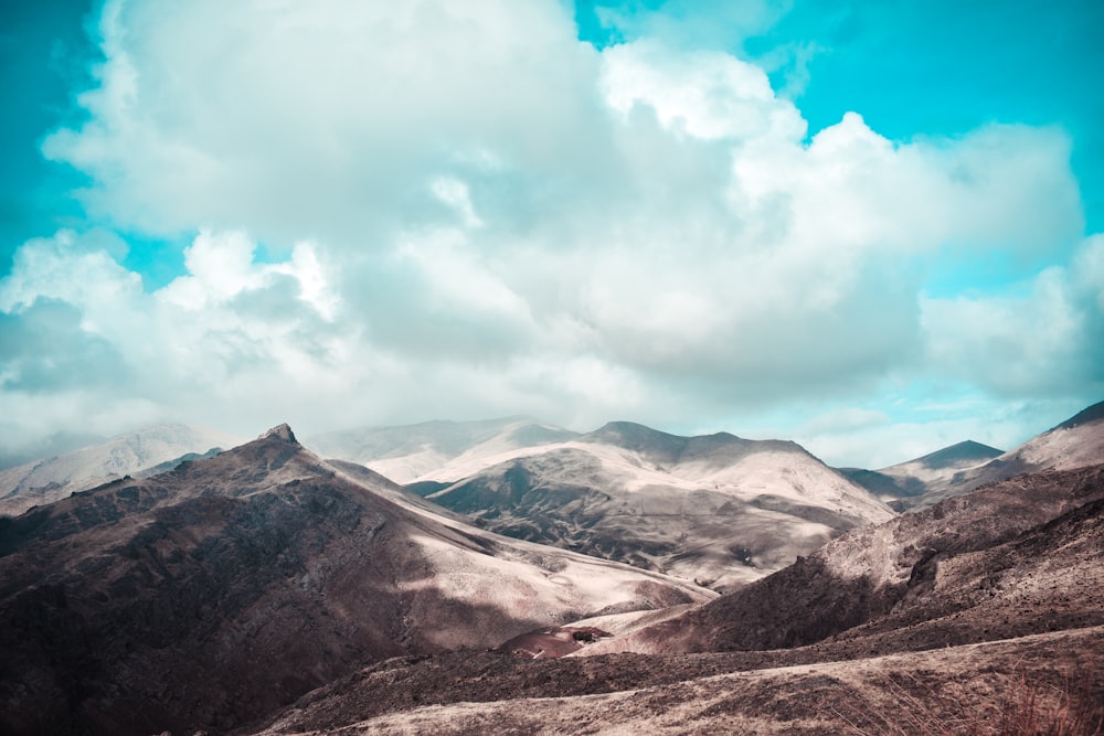 mountain under white clouds