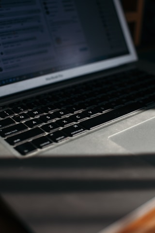 Close-up of a modern laptop displaying a detailed tech website interface.