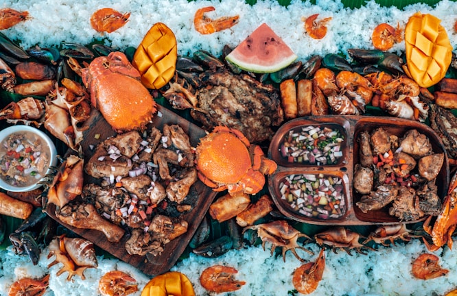 A vibrant boat day kit spread with smoked meats, seafood, sides, and dipping sauces ready for a waterfront feast.