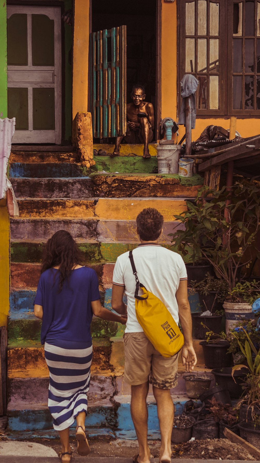 man and woman by the stairs