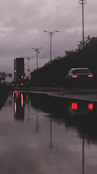 A moody urban street scene graphic with layered text and shadowed elements.