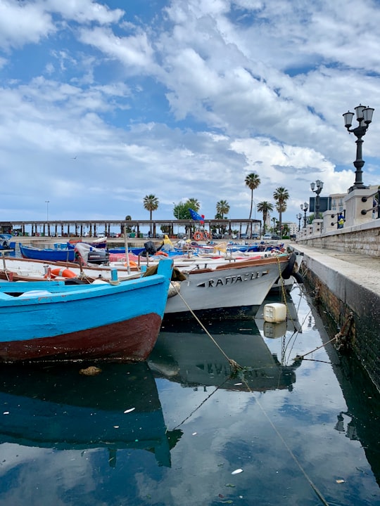 boat on body of water near coast in Bari Italy