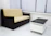 A sleek black and white luxury sofa in a modern living room setting.