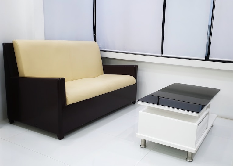 A modern living room featuring a stylish sofa and coffee table.