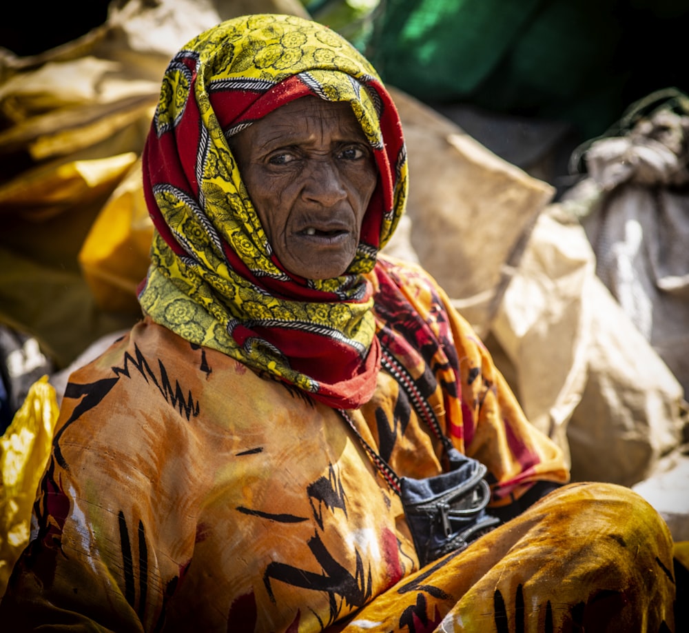 person in yellow and orange hijab scarf