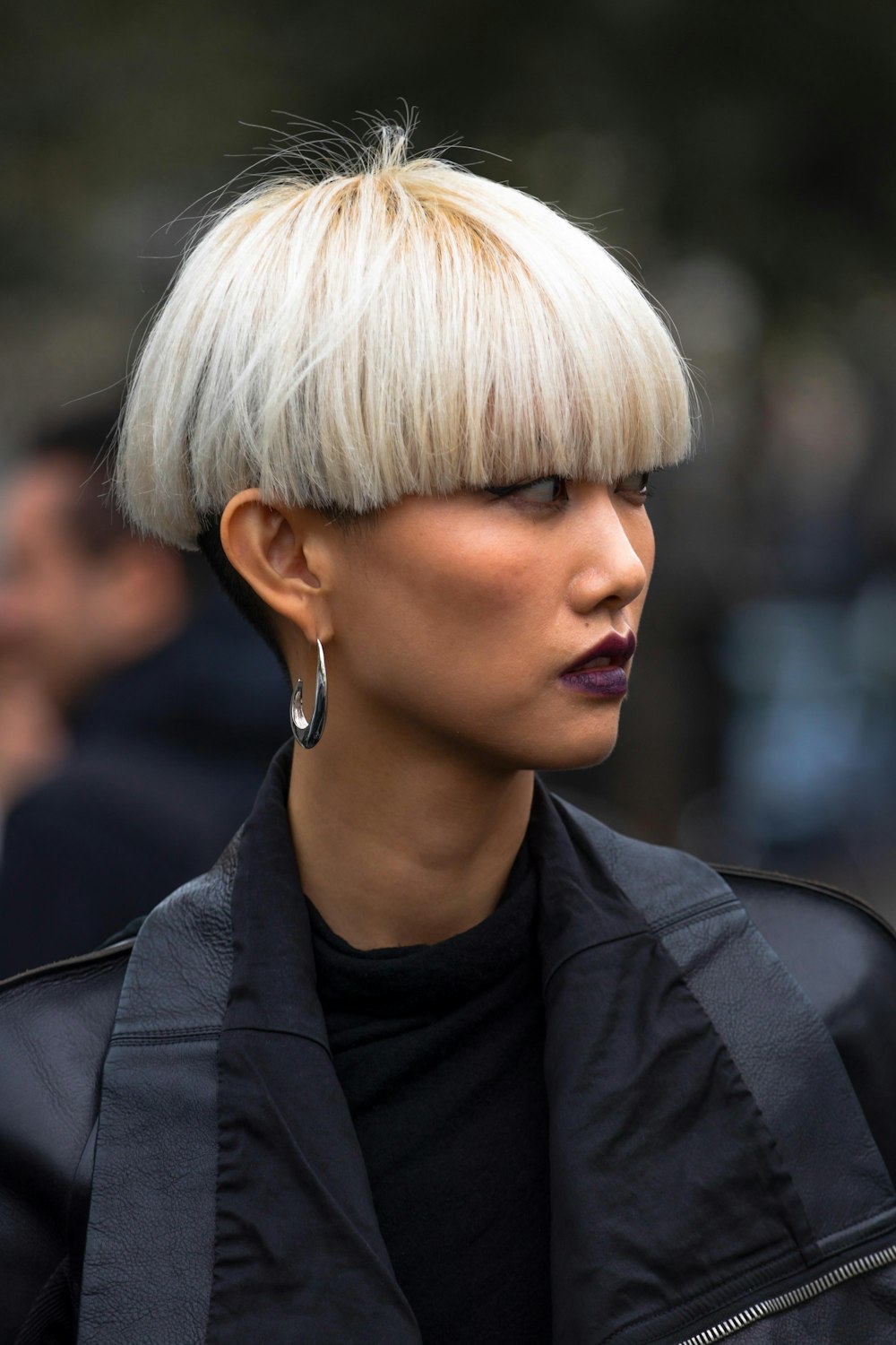 selective focus photography of woman wearing hoop earring