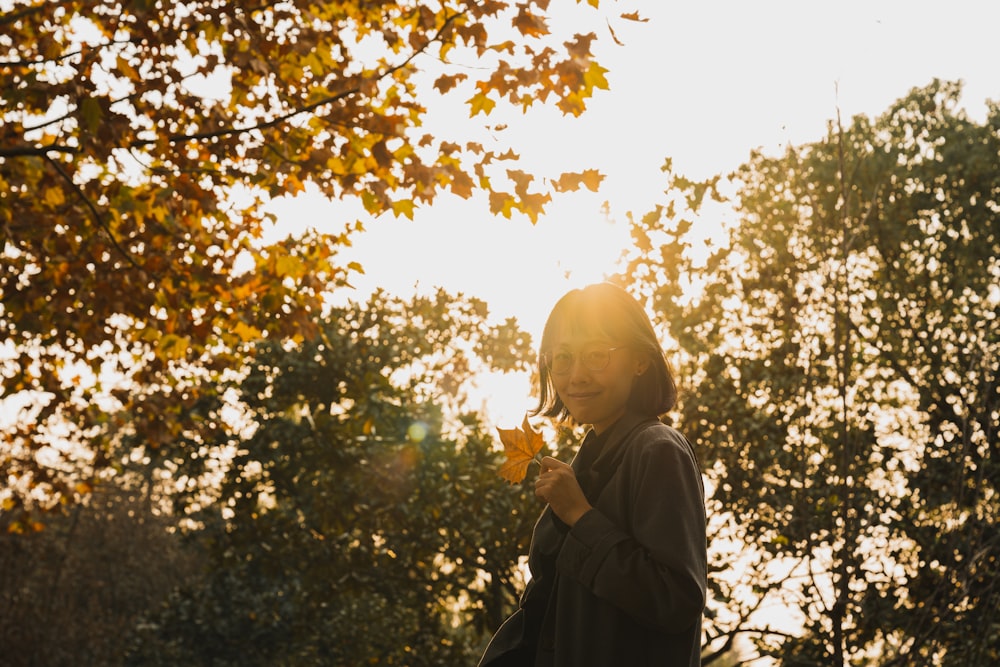 woman standing near trees during daytime