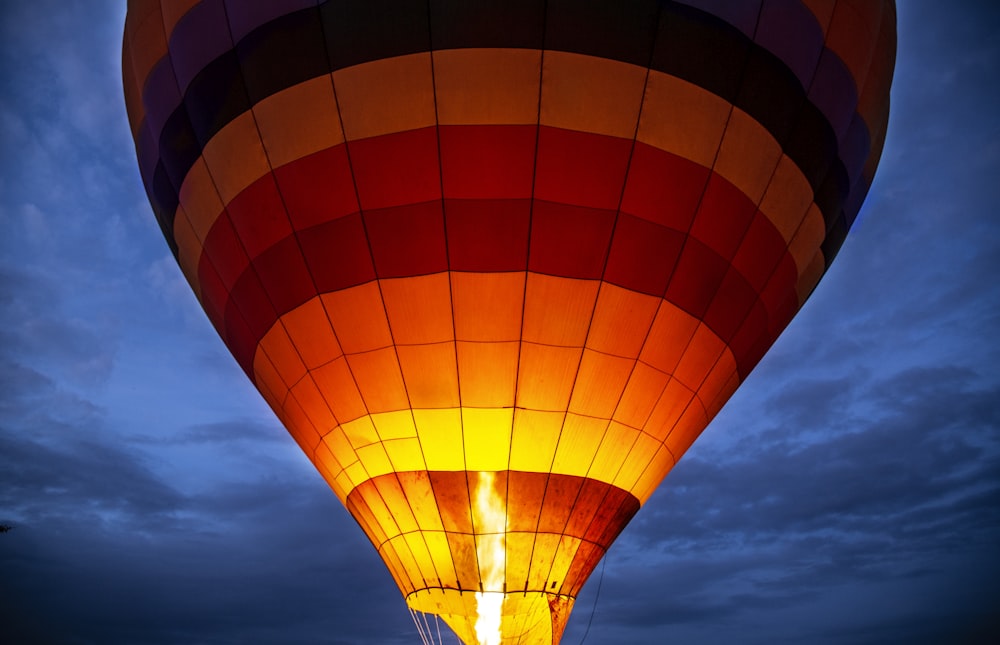 orange, red, and black hot air balloon