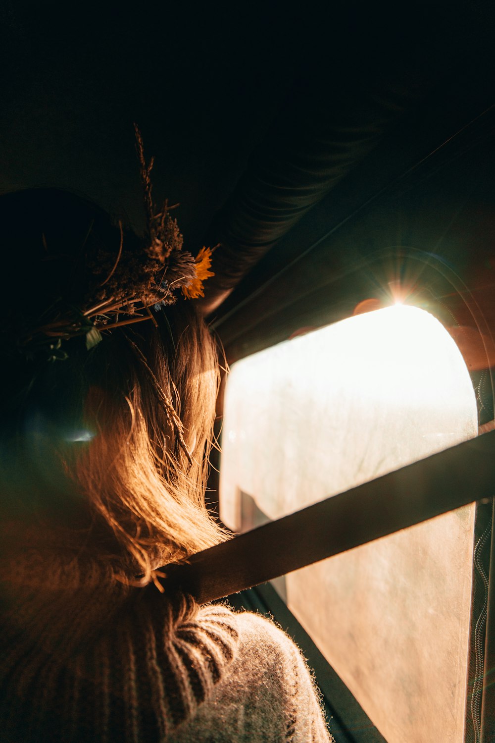 girl standing doorway towards light