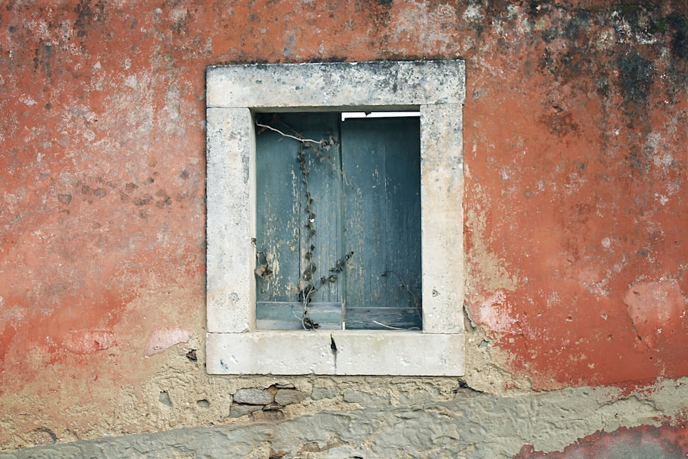 green and white wooden window