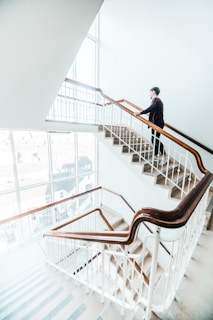 man walking on stair-top 10 Executive MBA programs in India