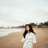 woman standing near beach line