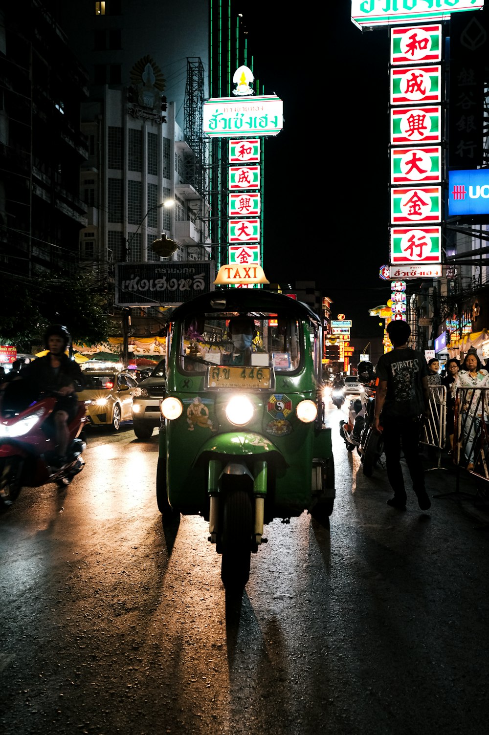 green tricycle on the road