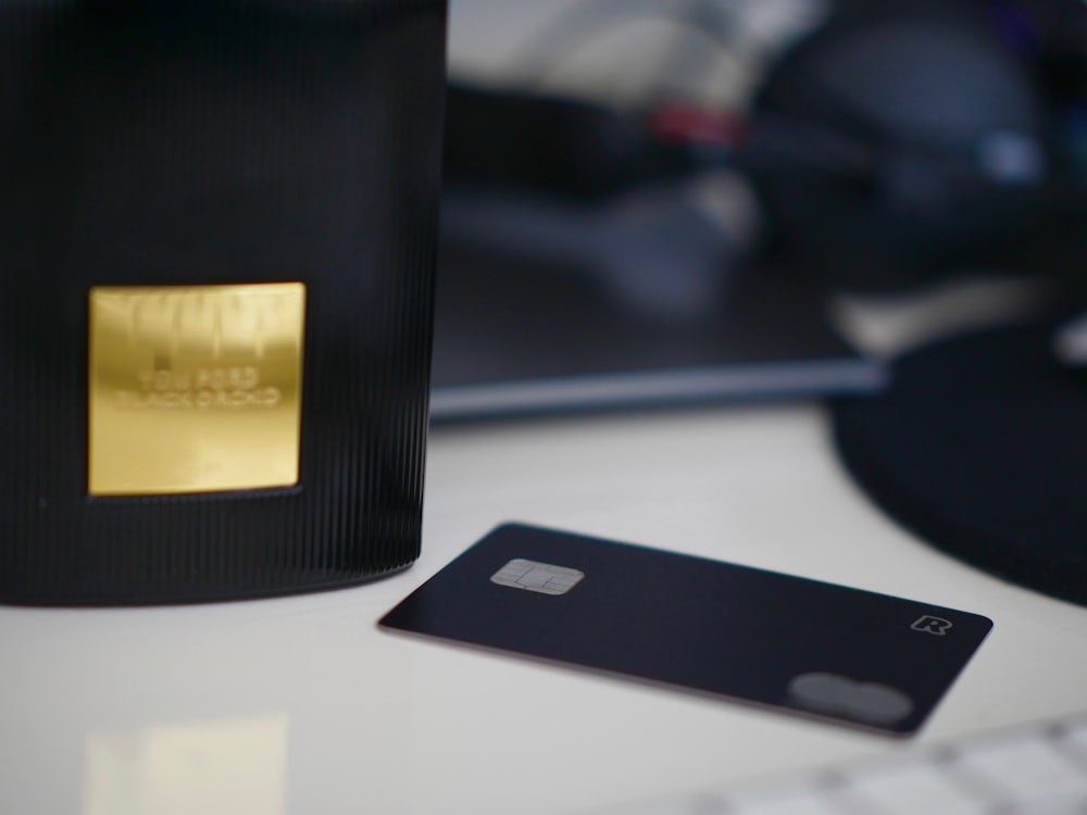 selective focus photography of black card on white table
