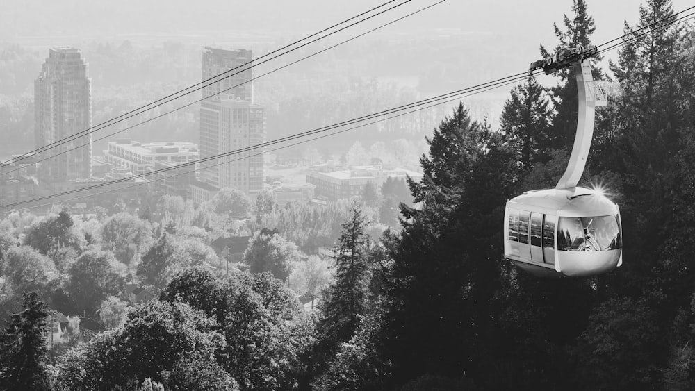 greyscale photography of cable car