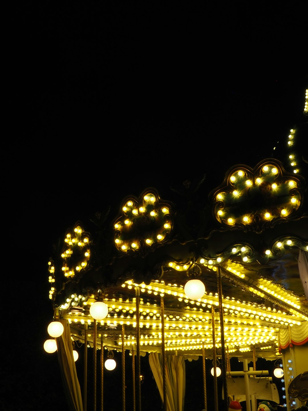 lit carousel at night