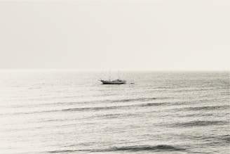 A serene sailing scene on a calm sea.