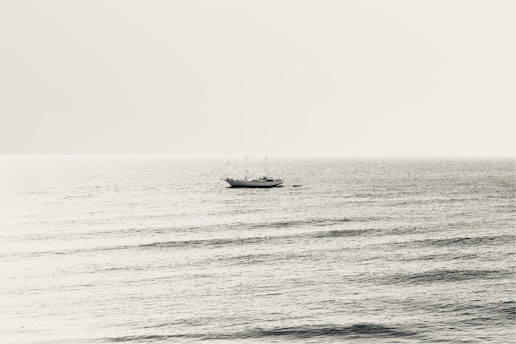 A serene sailing scene on a calm sea.