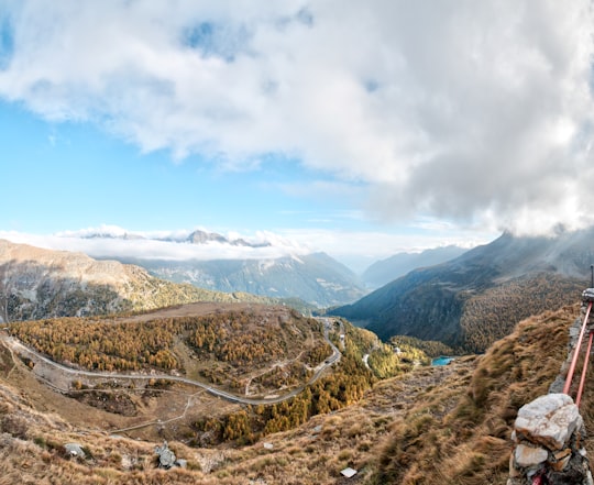 river surrounded bu mountains during daytime in Berninapass Switzerland