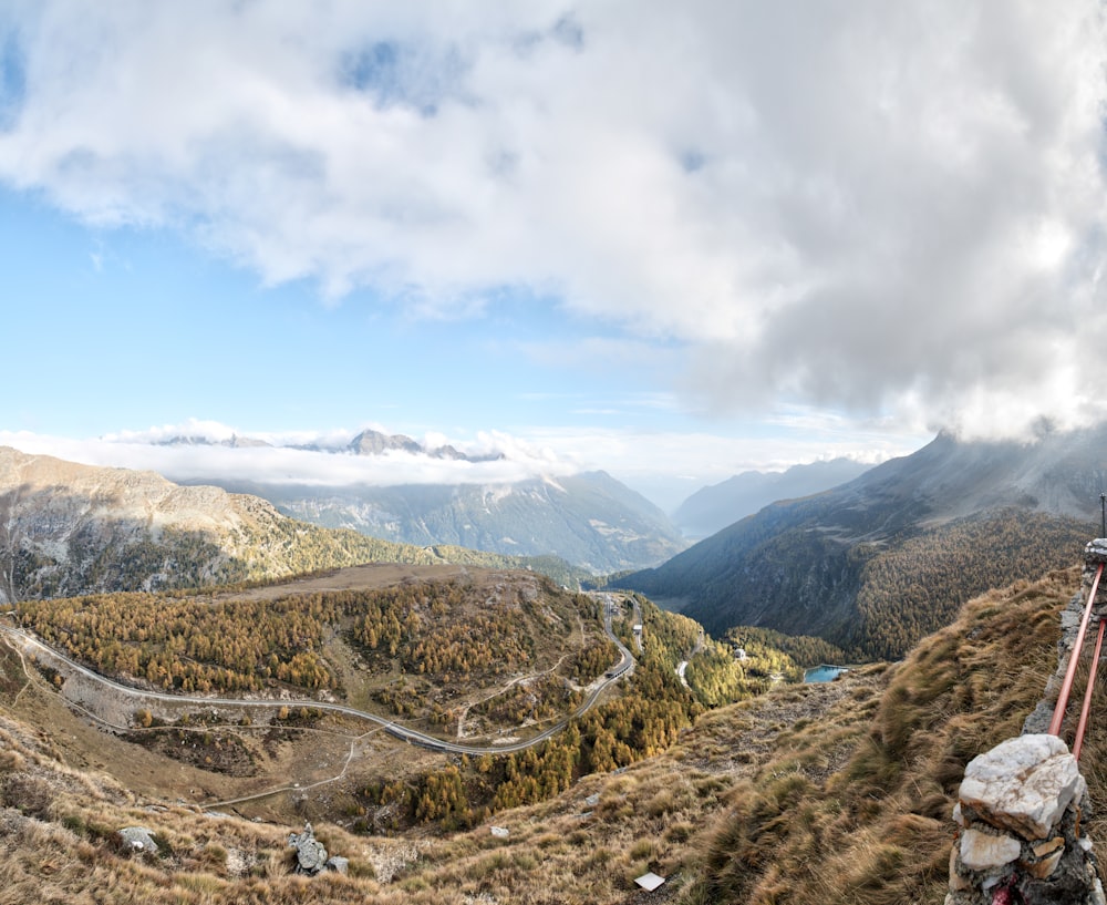 river surrounded bu mountains during daytime