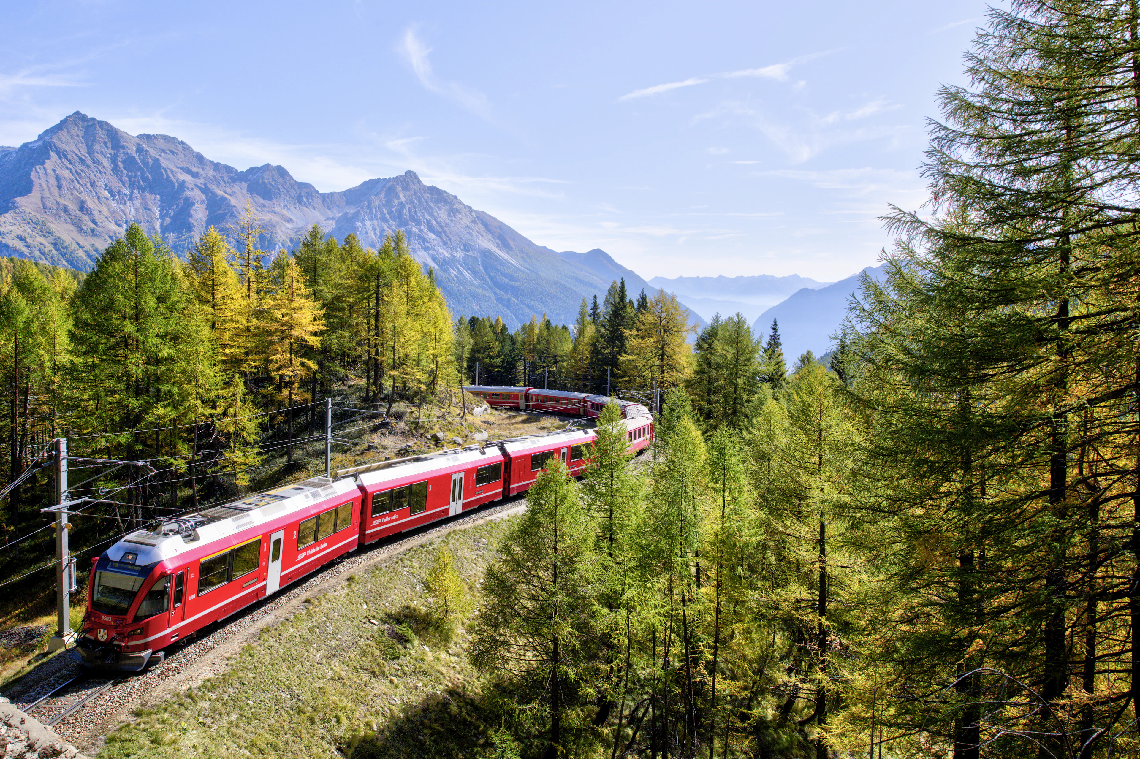 Swiss red train arriving at station