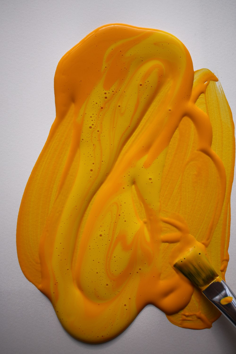 yellow paint mixed with orange paint