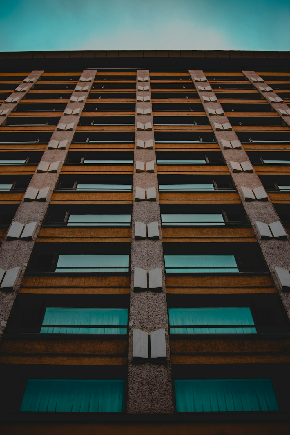 low-angle photo of high-rise building during daytime