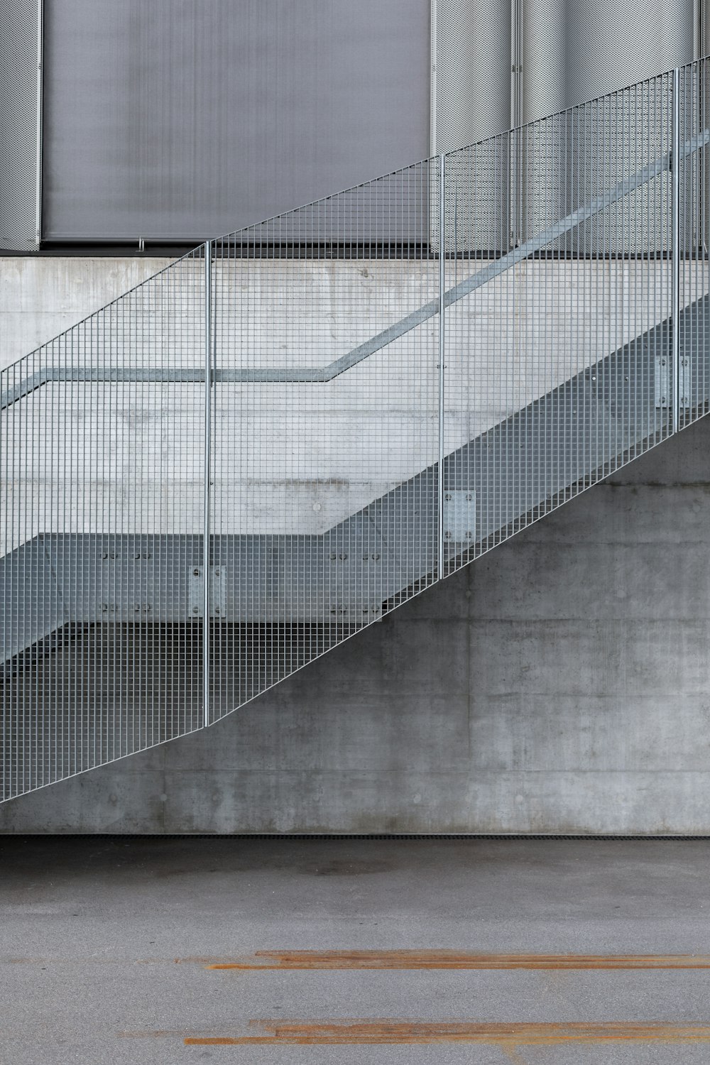 a man riding a skateboard down a metal hand rail