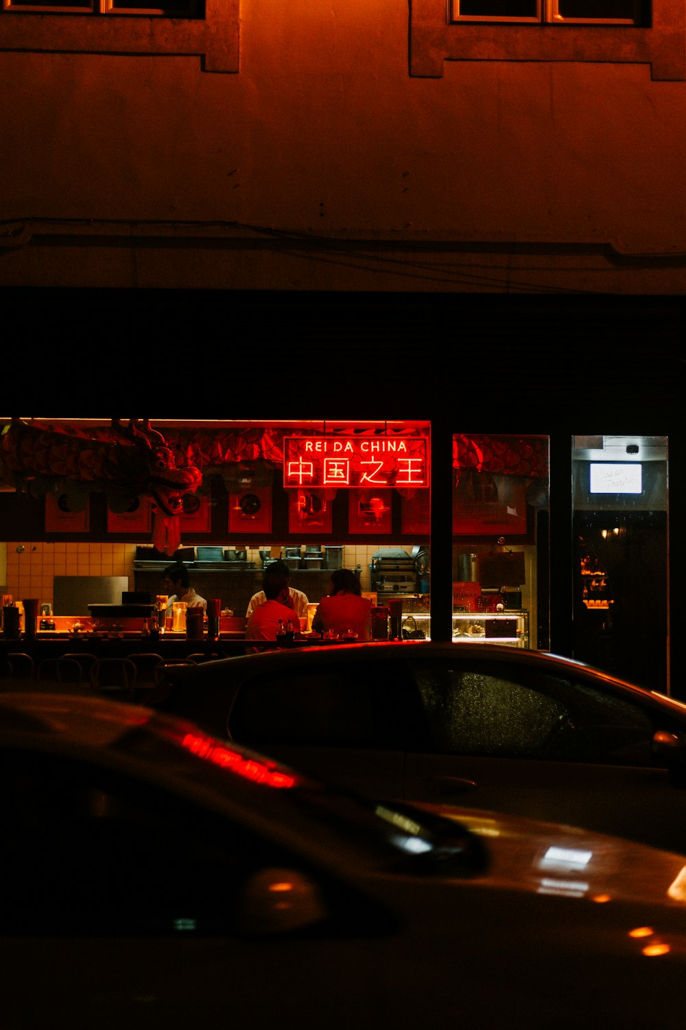 cars parked near bar during night time