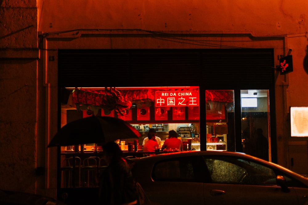 red neon sign on a Chinese store