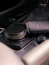 a close up of a cell phone on a car dashboard